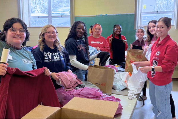 Volunteer – Clothing Ministry A group of female volunteers from Saginaw Valley State University at one of Midland's Open Door's clothing assistance work days.